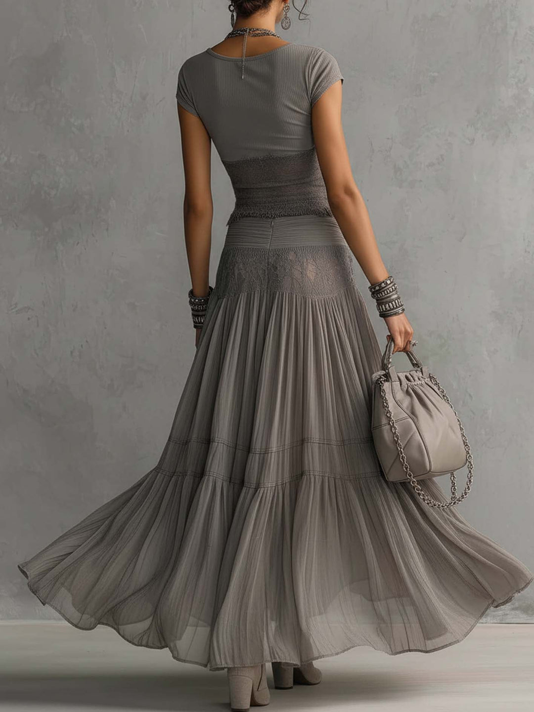 Geneva · Set consisting of a transparent top with black lace panels and a maxi pleated skirt